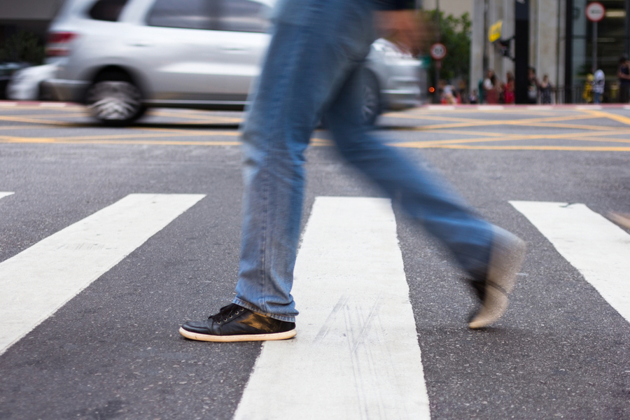 what anxiety feels like - a blurred image of a person walking across a crosswalk