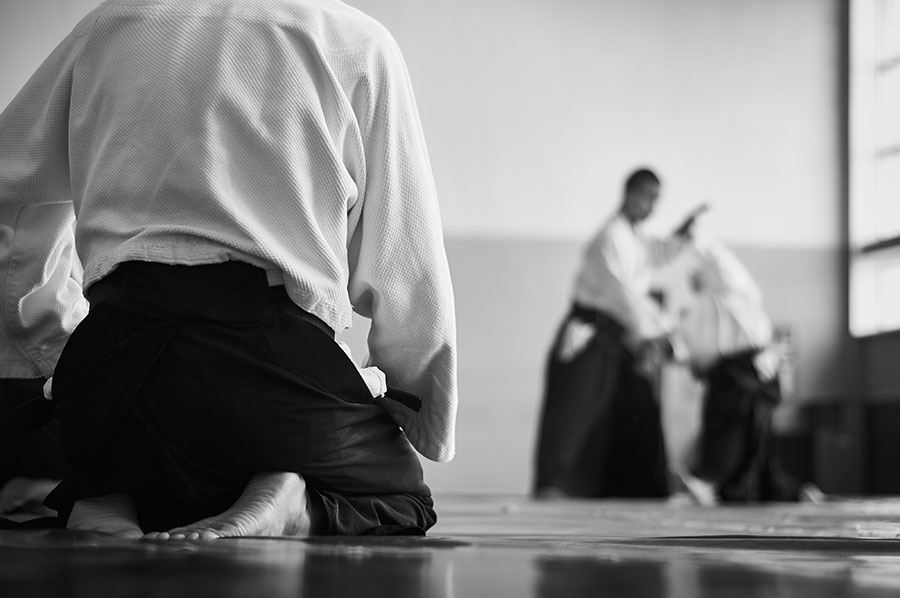 what is respect? A black and white image of an aikido practitioner showing respect.